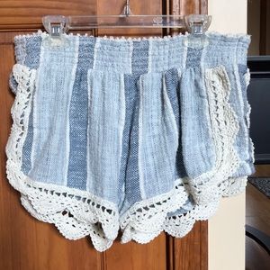 Blue striped shorts with cream crocheted trim